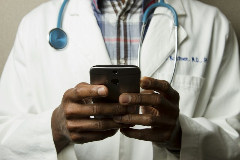 Medical doctors explaining hydration guidelines, emergency contacts, and vaccine verification.